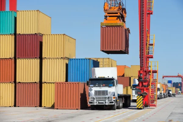 gantry-crane-placing-a-container-on-a-truck-beside-2026-03-26-09-05-29-utc